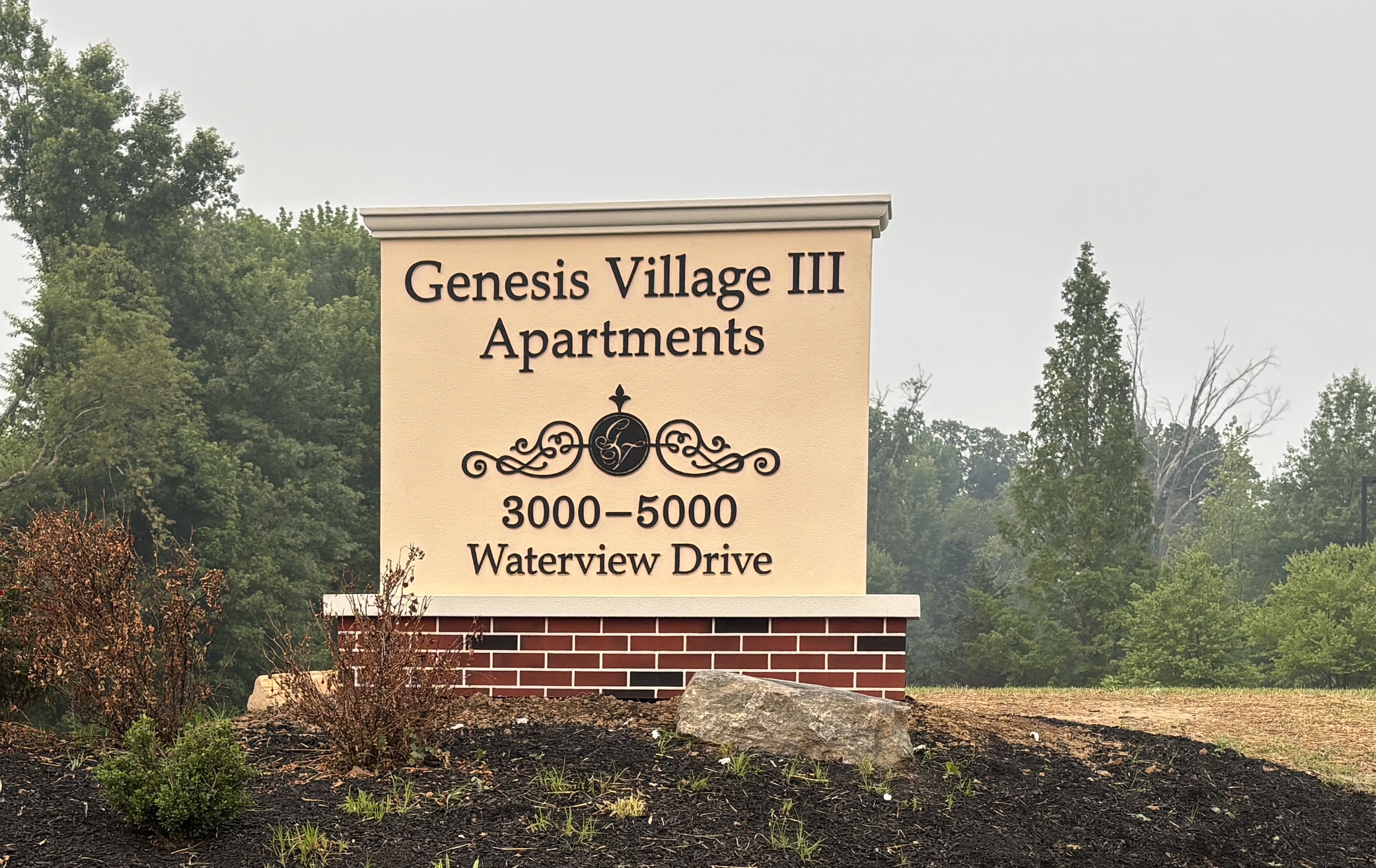 Genesis Village III Apartments monument sign
